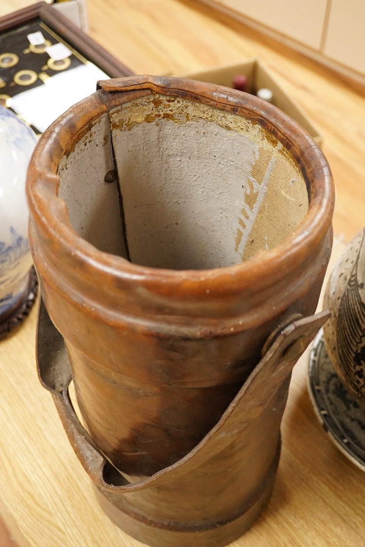 A late 19th century leather shot carrier printed with The Royal Coat of Arms, 46cm high